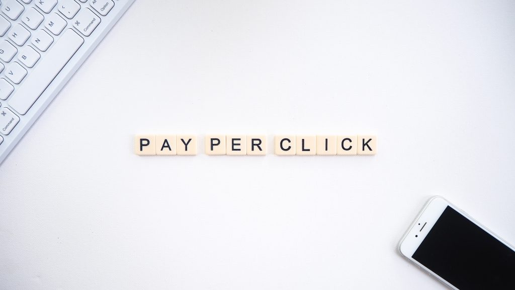 pay per click letters on a white table